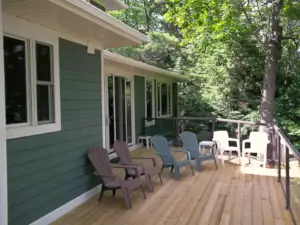 A spacious lakeside deck offers comfortable outdoor entertaining space in Summer weather.