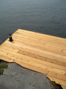 Beautiful granite flagstone stairs connect the cottage on this property to the swim dock.