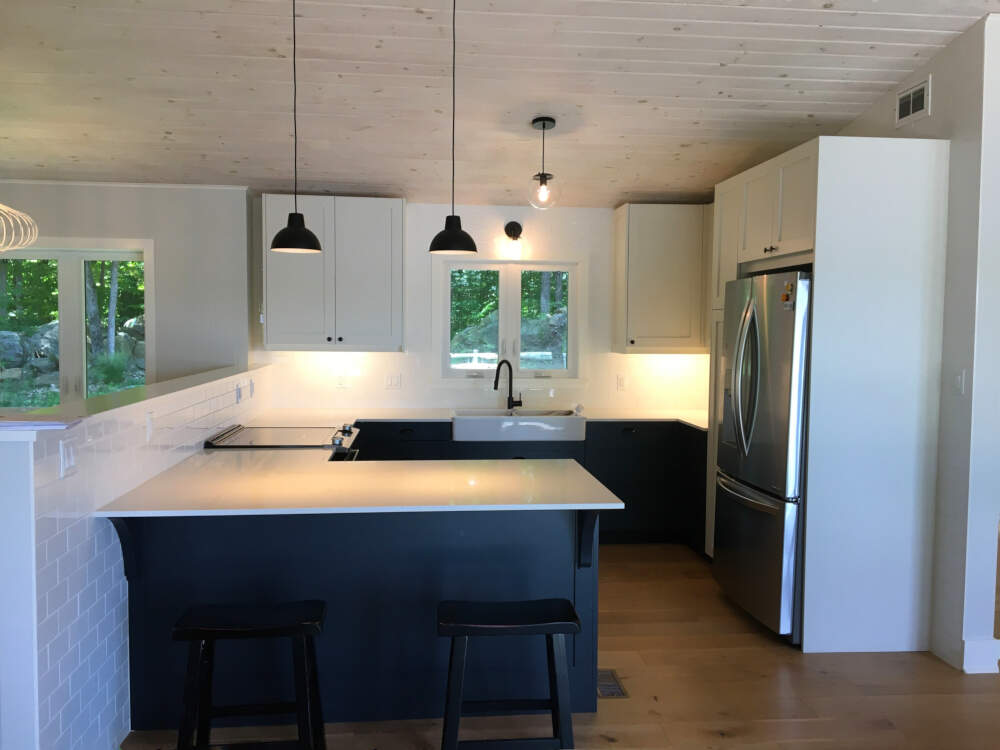 A cost-effective IKEA kitchen cabinet package with custom door & door fronts in a Lake Muskoka cottage kitchen.