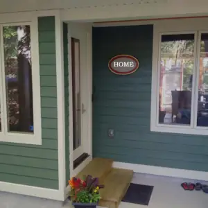 The entry door leads from the driveway into an entry foyer incorporating staircase that accesses all storeys of the building.