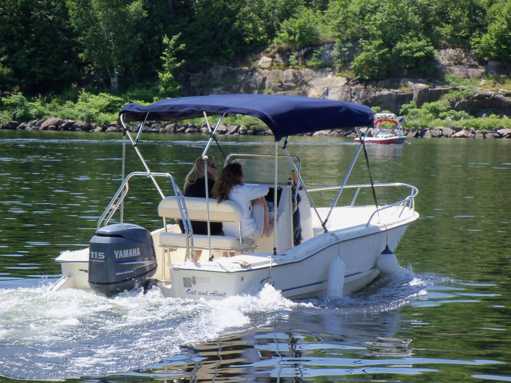 Mother and daughter boating from the locks in Port Carling, Muskoka, Ontario.